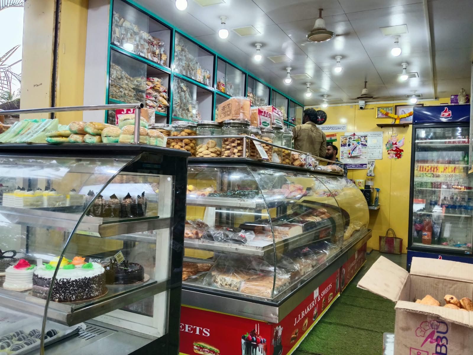 Glass counters lined with fresh bakes at J J Bakery